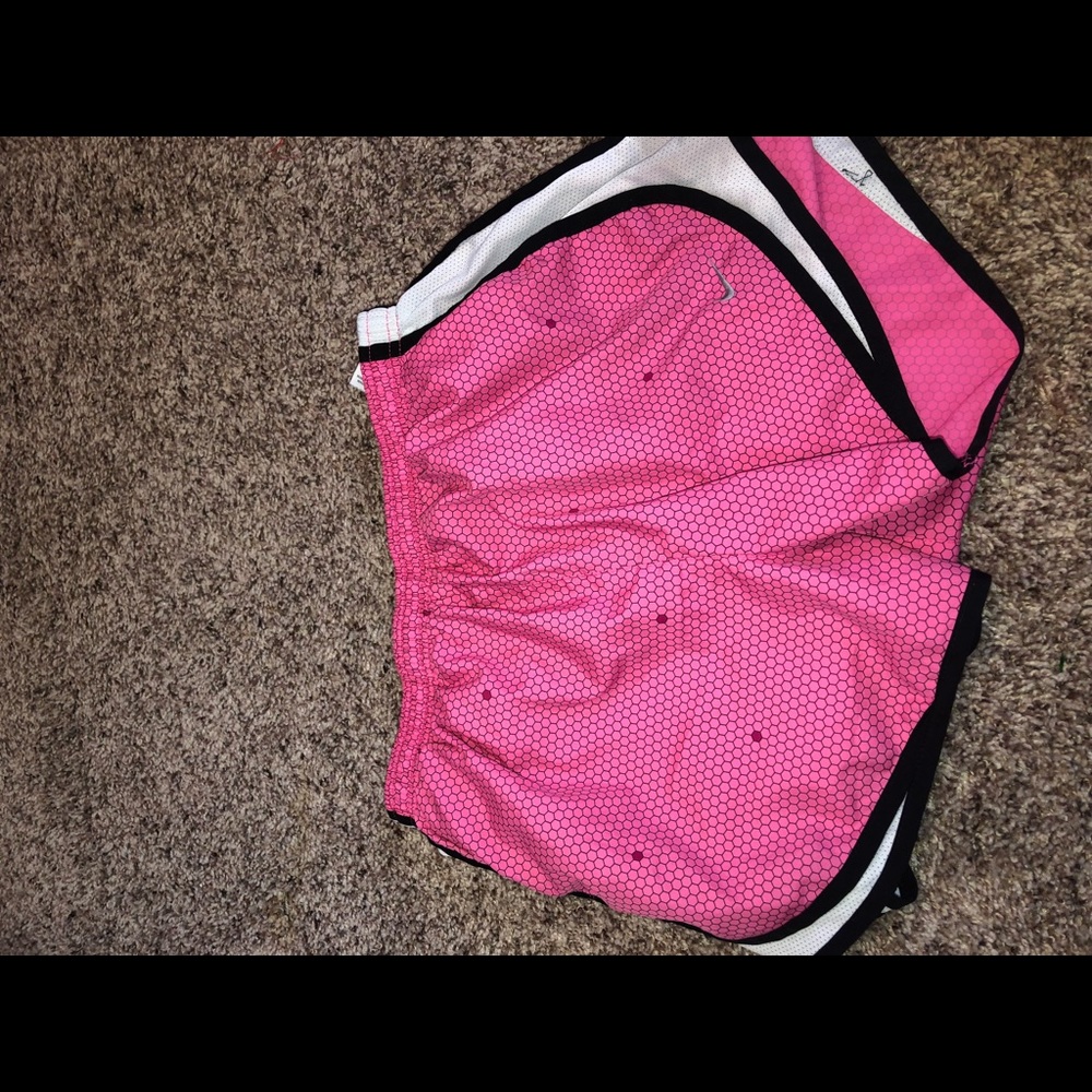 Pink nike shorts with dot designs